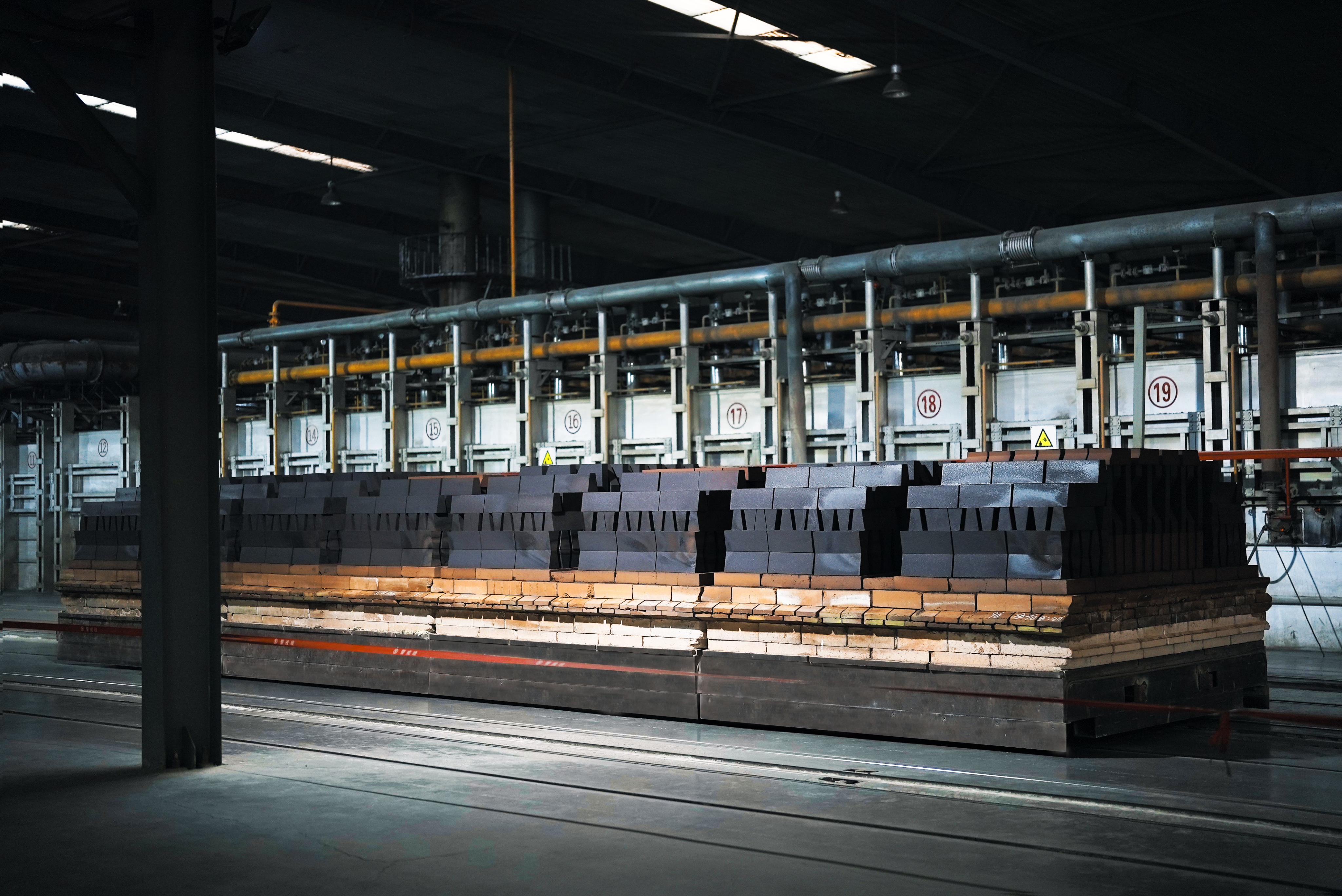 Photo of a study hall with wooden tables and chairs.